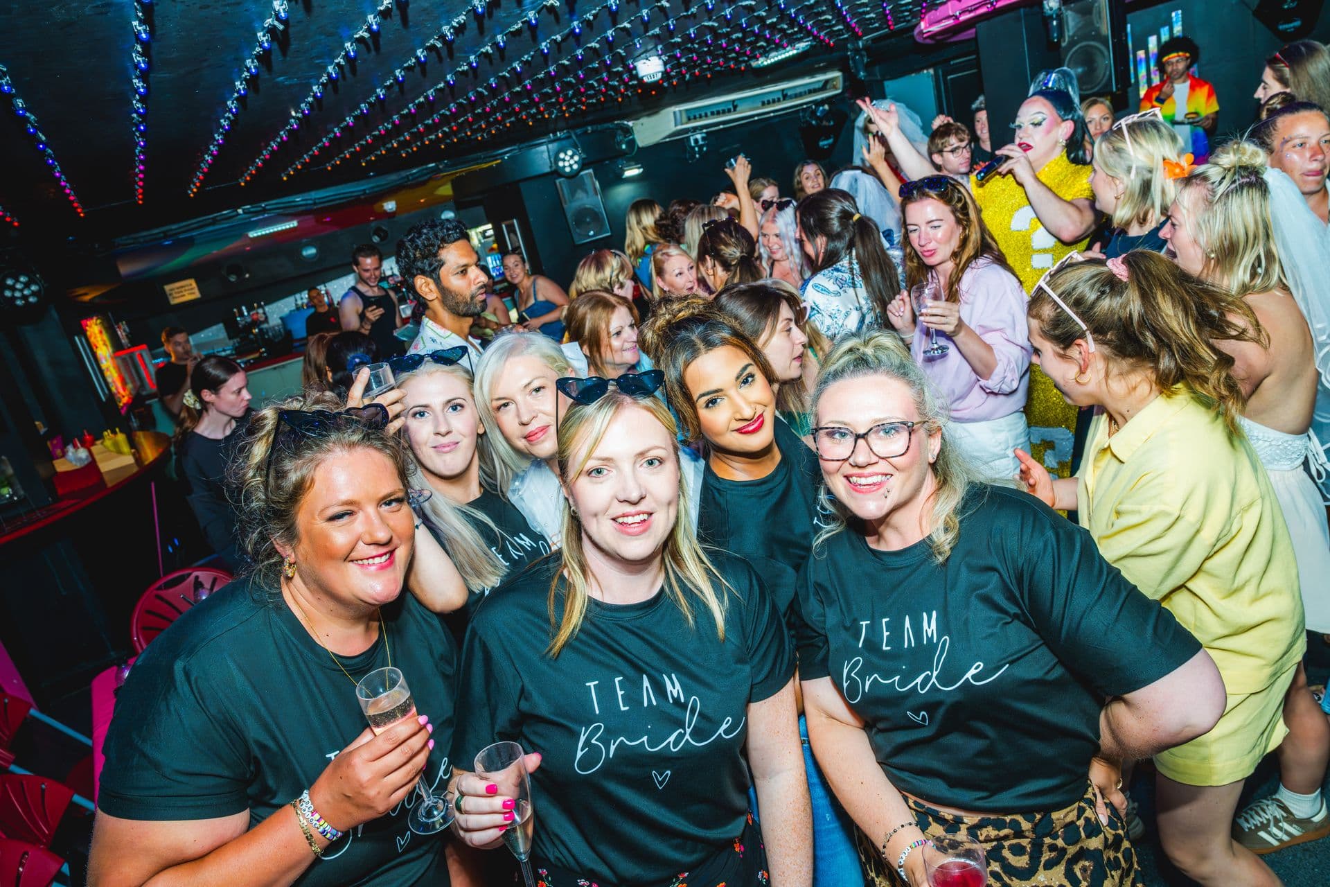 A Team Bride hen party posing together at Legends Brighton
