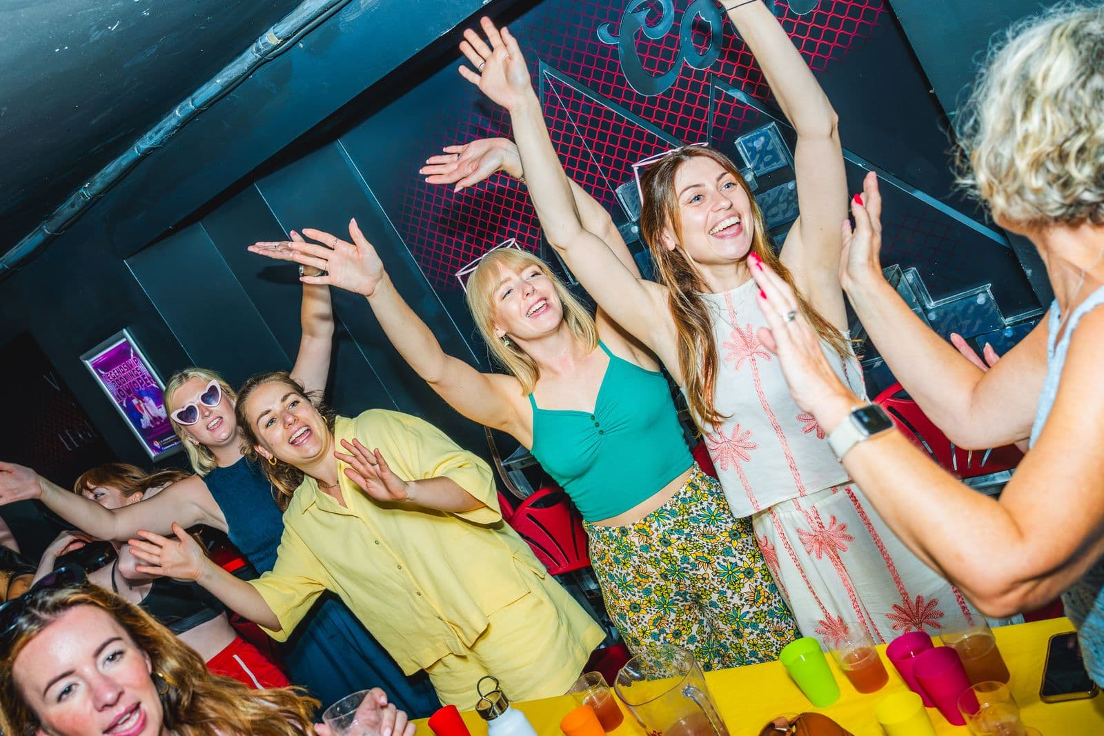 Guests partying with their arms in the air